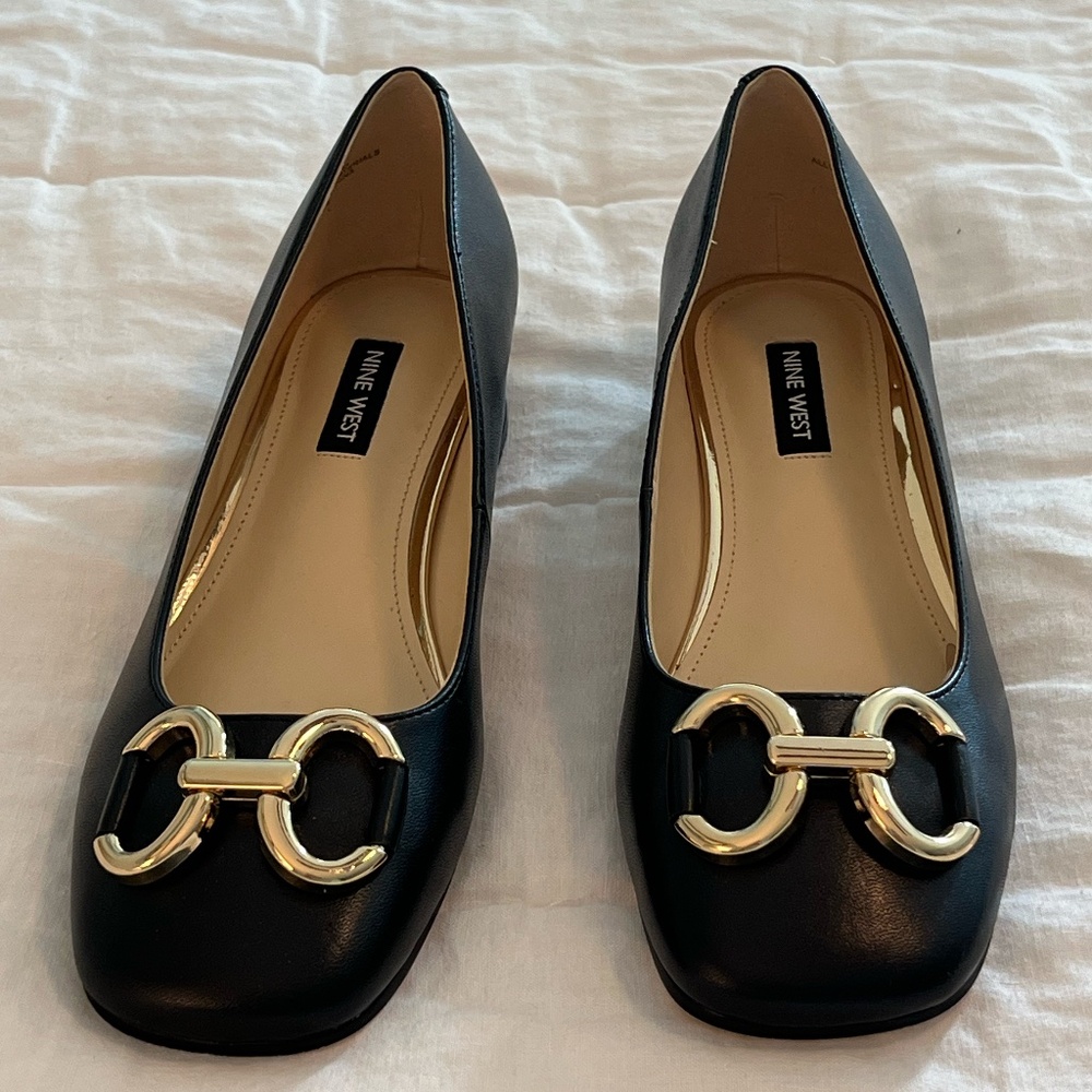 New 9 West loafer-style shoes with gold accent buckles. Size 7.5.